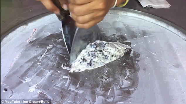 The ice cream makers then use metal paddles to mix and chop up the base