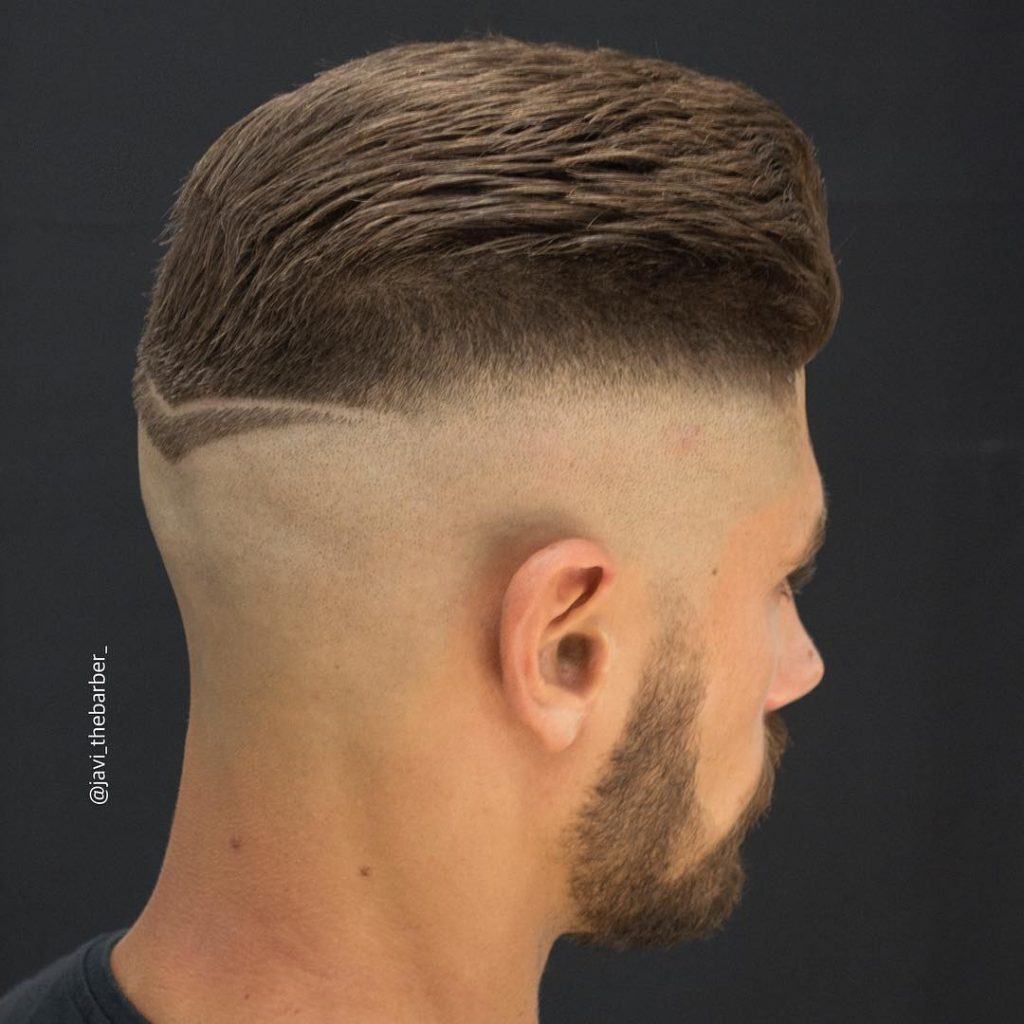 Thick short haircut for men with bald fade and hair design