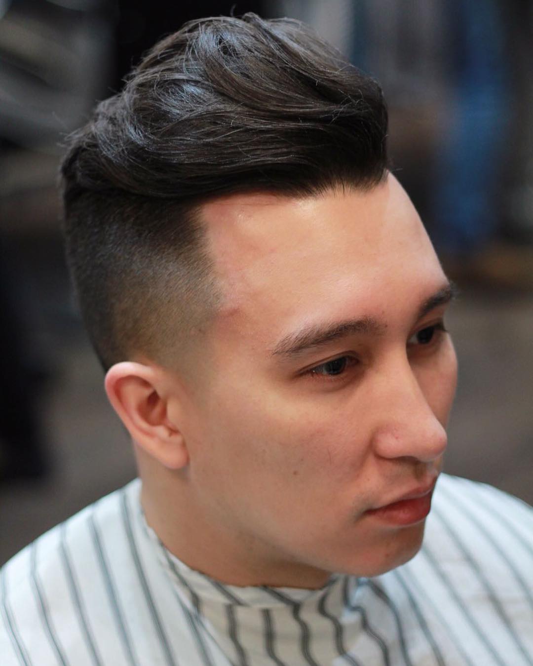 Medium length textured pompadour haircut