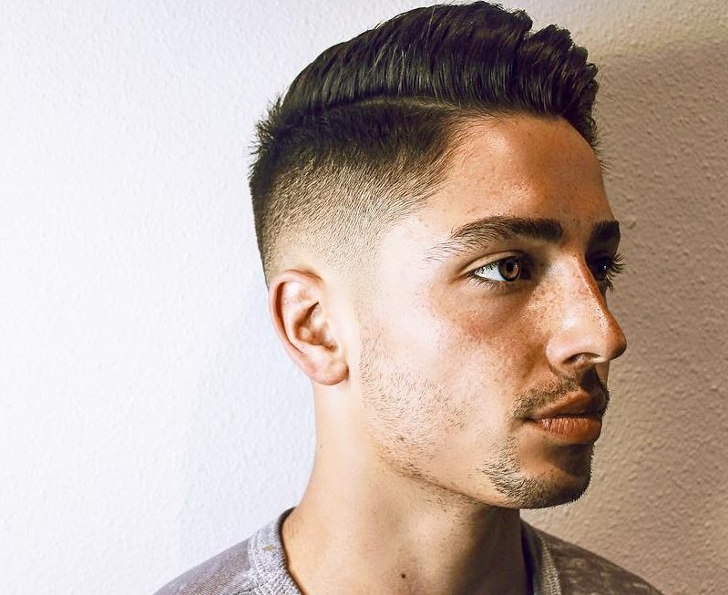 Comb over haircut with mid fade